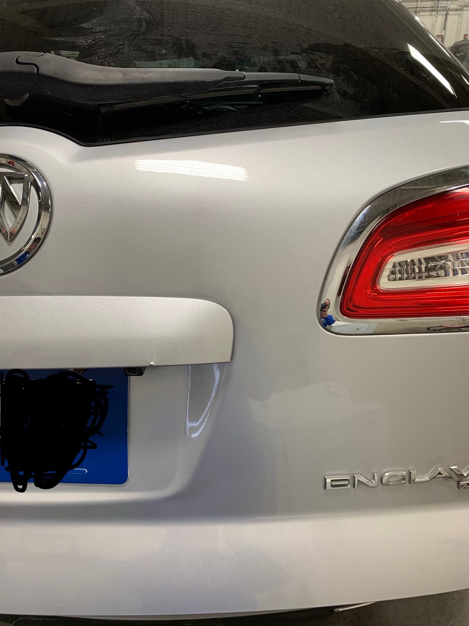 the buick enclave with the large dent completely fixed