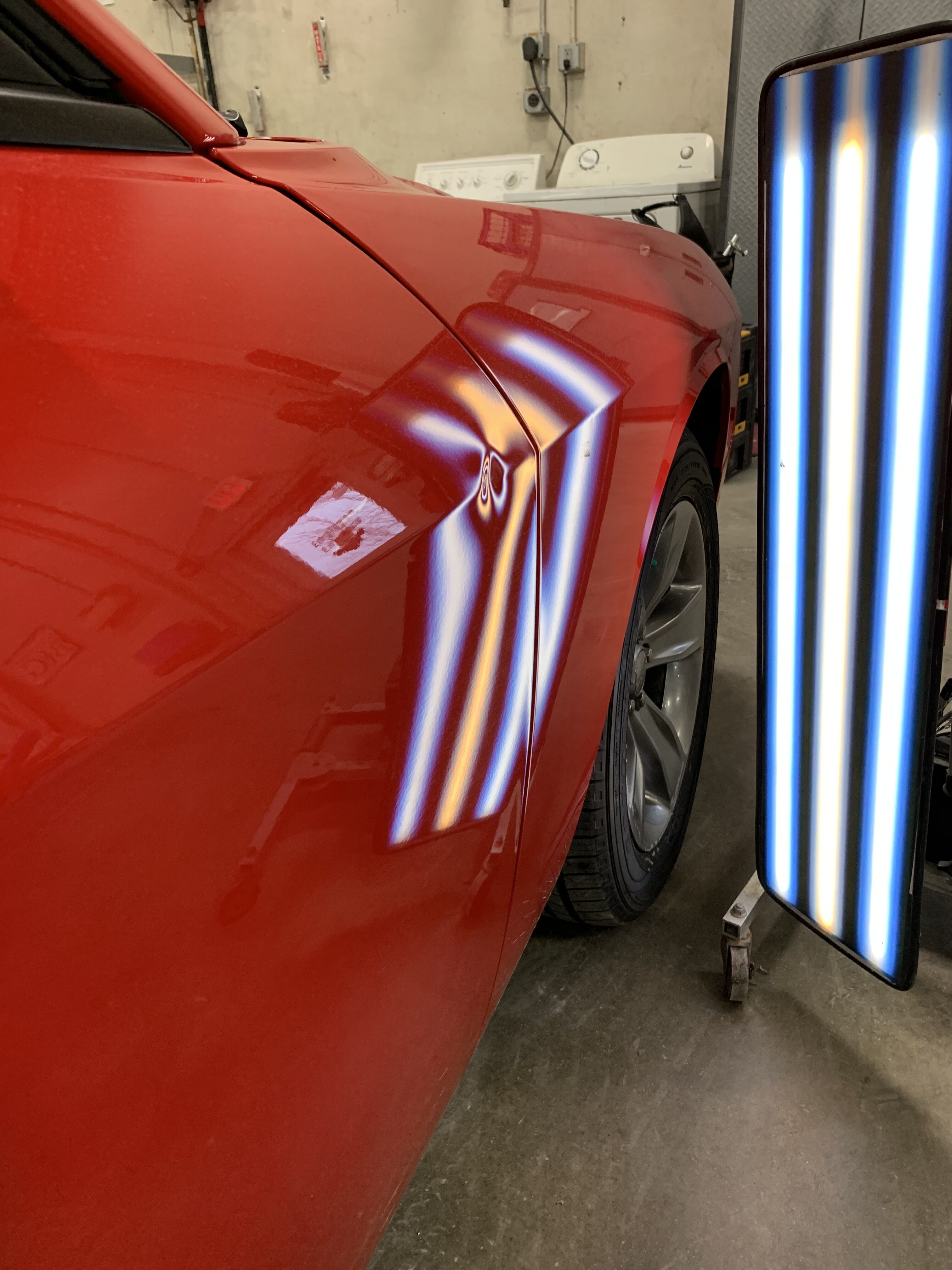 challenger with a small dent on the door