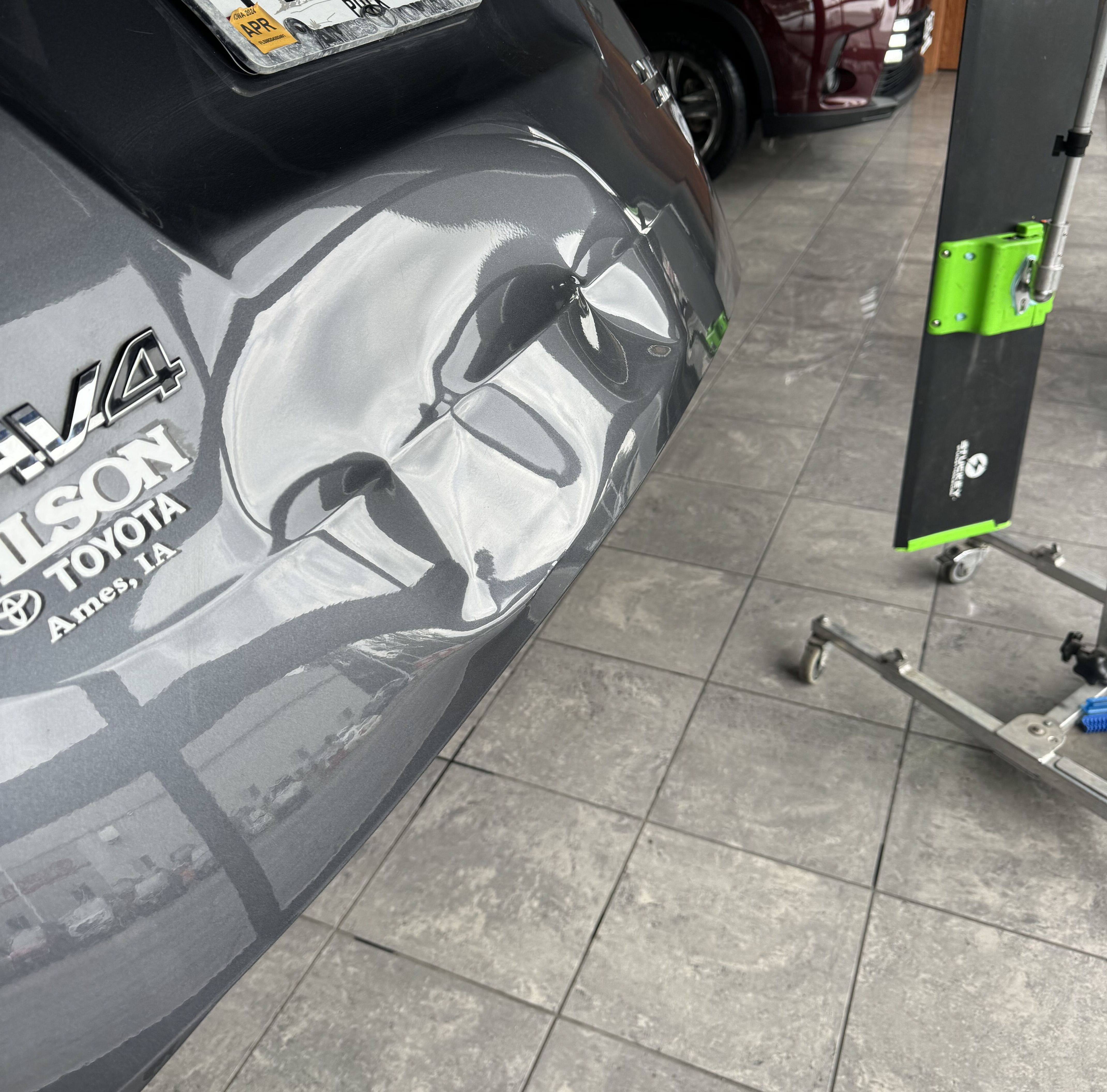 a rav4 with a huge dent on it's trunk